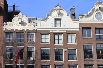 Amsterdam Keizersgracht Canal House Facades with White Decorated Roof Tops Close Up, Netherlands