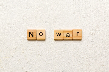 No war word written on wood block. No war text on table, concept