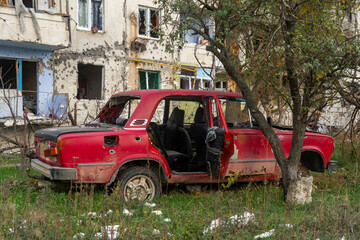 War in Ukraine. 2022 Russian invasion of Ukraine. A destroyed civilian car stands near a destroyed...