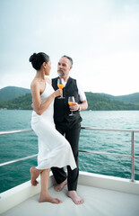 Happy moments of interracial couples on a yacht The couple had their honeymoon at one of Asia's