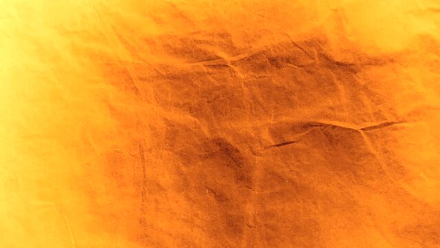 Stop motion animation background of crumpled paper in a grunge sepia style.