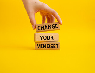 Change your mindset symbol. Concept words Change your mindset on wooden blocks. Beautiful yellow background. Businessman hand. Business and Change your mindset concept. Copy space. - obrazy, fototapety, plakaty