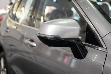 Side mirror of the modern luxury car with turning light signal, 360 camera and blind spot camera...