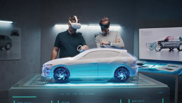 Design engineers in the studio use a diagnostic app to test the parameters of a new sustainable eco-friendly electric vehicle. They use a holographic interface and vr headset
