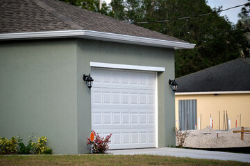 Wide garage double door and concrete driveway of new modern american house