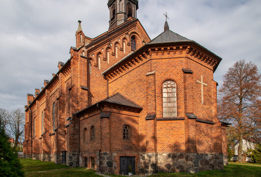 General view and architectural details of the brick belfry built in 1875 and the Catholic Church of the Immaculate Conception of the Blessed Virgin Mary in Ceranów in Mazovia, Poland.