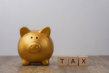Savings concept for paying taxes. golden pig piggy bank