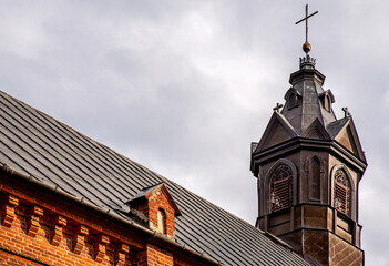 General view and architectural details of the brick belfry built in 1875 and the Catholic Church of the Immaculate Conception of the Blessed Virgin Mary in Ceranów in Mazovia, Poland.