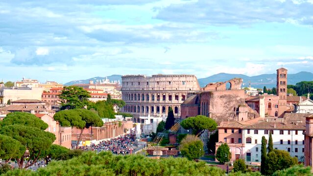 The Colosseum panorama, Colosseo, iconic amphitheatre Arena in the centre of the old town of Rome, Roma, just east of the Roman Forum. RAW cinematic footage