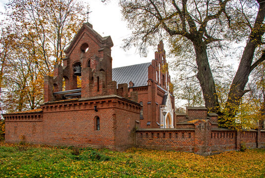 General view and architectural details of the brick belfry built in 1875 and the Catholic Church of the Immaculate Conception of the Blessed Virgin Mary in Ceranów in Mazovia, Poland.