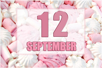 calendar date on the background of white and pink marshmallows. September 12 is the twelfth day of the month