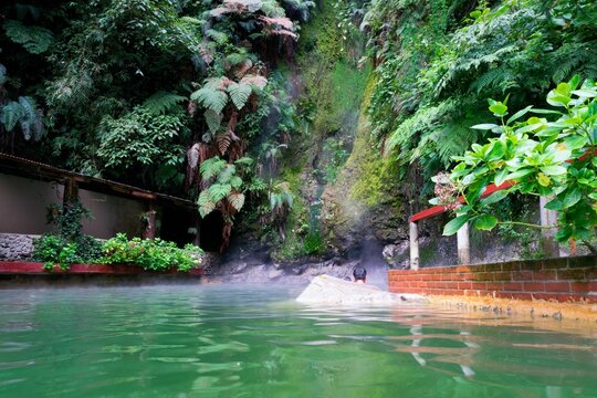Hot spring surrounded by vegetation at Las Fuentes Georginas in Zunil, Guatemala