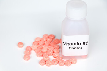 Vitamin B2 pills in a bottle, food supplement or used to treat disease