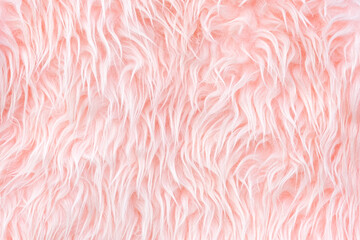 Texture of light pink long artificial fur close up. Home decor and comfort concept. Horizontal banner with copy space.