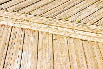 Old wooden floor slats for outdoor use stuck with metal nails