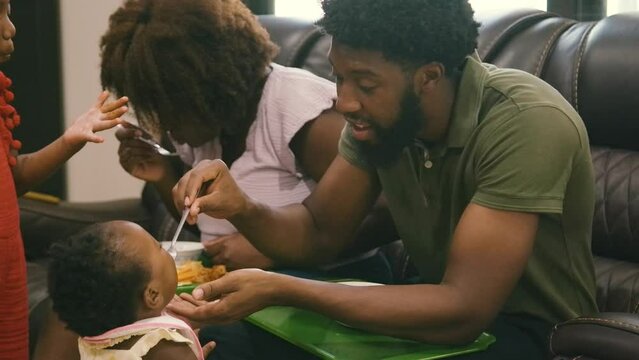 Young Black children, Black girls, Black boy, Black infant baby, Black parents, Black mother, and Black father eating lunch and dinner at home
