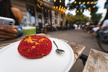 Delicious Cake shu eclairs with red strawberry crumble on table