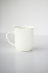 white cup on white background