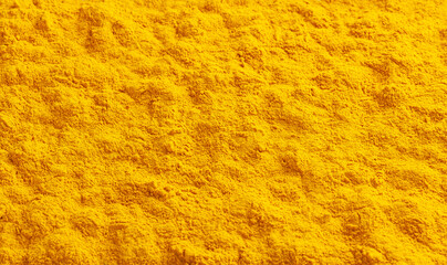 Dry turmeric (curcuma) powder background