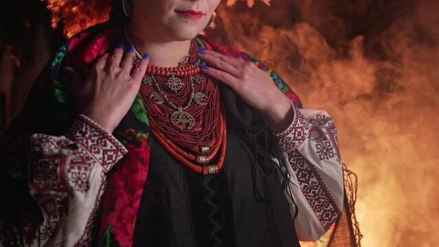 Demonstrating traditional antique jewelry necklace. National costume of Ukraine. Ukrainian woman in legacy ancient coral beads, Zgarda - archaic hutsul neck ornament of status religious purpose
