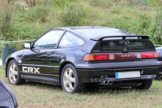 Classic black sports car Honda Civic CRX standing on the green grass