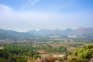 Fototapeta premium landscape view of a nature park with mountains under cloudy blue sky