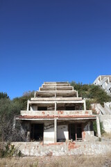 Lost places: An unfinished hotel complex in Izmir, Turkey with 96 apartment rooms is left to decay. Terrace construction already overgrown by nature lies in ruins