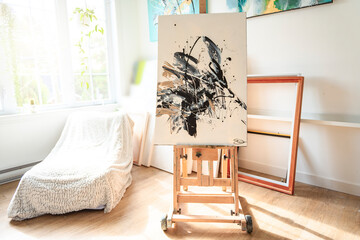 Artist's workshop. Canvas, paint, brushes, palette knife lying on the table.