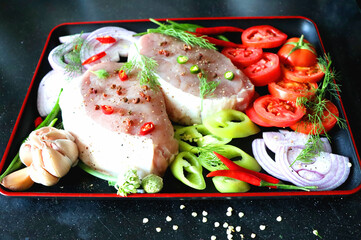 Meat with vegetables and spices, onions, red and green peppers, ginger, dill