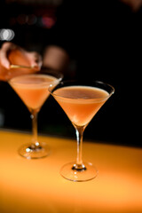 selective focus on thick cocktail in martini glass on bar counter