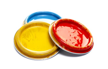 Colorful group can lid with spillage isolated on white 