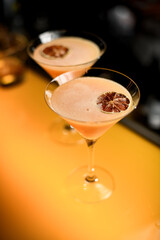 Close-up high angle view on glasses with cocktail decorated with dry citrus slice