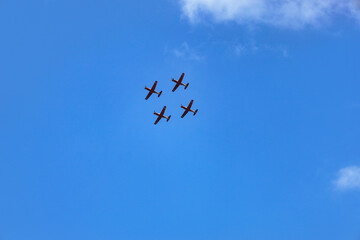 Modern airplanes flying in blue sky