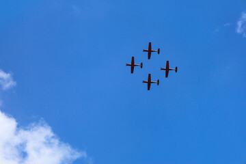 Modern airplanes flying in blue sky