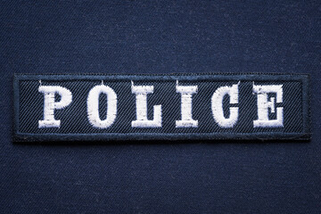 Embroidered hook and loop police badge, close up	