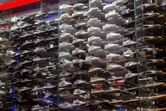 Prague, CZ- 19 January 2022: shop window with a Lots of different sneakers and sport footwear. Editorial