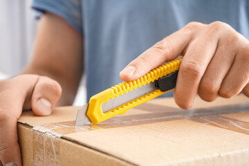 Man opening box with utility box, closeup