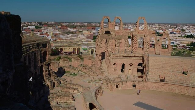 Ruins of Amphitheatre of El Jem with arena, large shot of the biggest colloseum in North Africa. Visiting old cities concept.