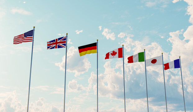 G7 flags of countries of Group of Seven Canada, Germany, Italy, France, Japan, USA states, United Kingdom. Blue sky background.