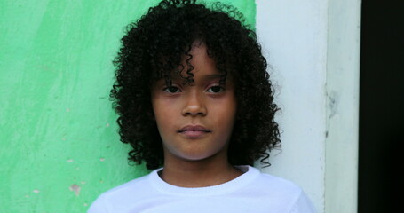 Brazilian child portrait face close-up. Hispanic south american kid