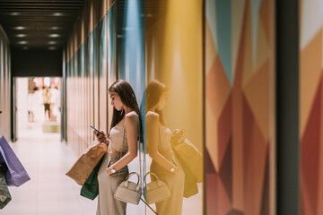 Girl with phone at the mall