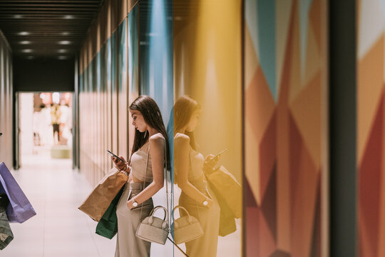 Girl with phone at the mall