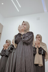 Group of Muslim Women Praying at Home