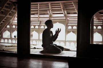 Silhouette of Person Praying at Mosque