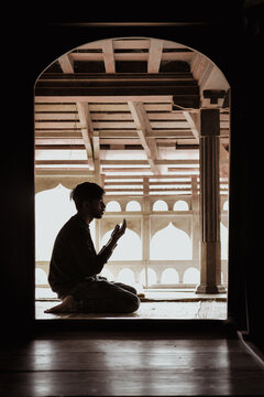 Silhouette of Person Praying at Mosque