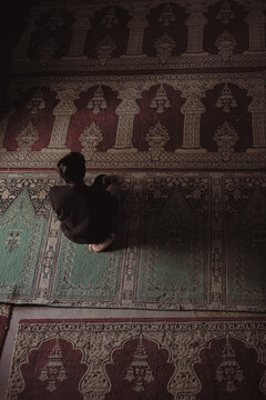 Muslim Men Praying at Mosque, detail of a mosque