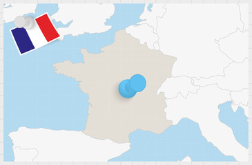 Map of France with a pinned blue pin. Pinned flag of France.