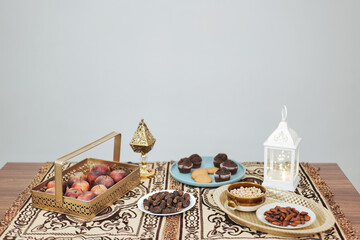 Happy Indian Muslim family celebrating Eid Mubarak and Having Eid Feast at Home