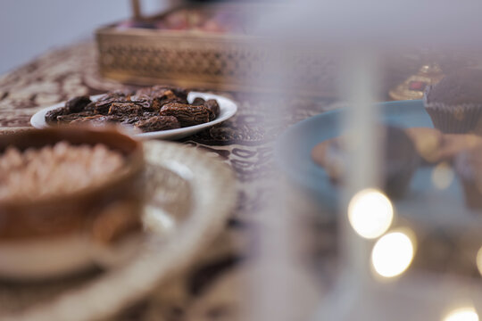 Happy Indian Muslim family celebrating Eid Mubarak and Having Eid Feast at Home