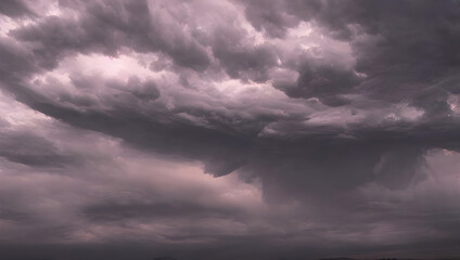 Obraz premium a supercell storm / thunderstorm with dark clouds far away in the distance on an open farming field